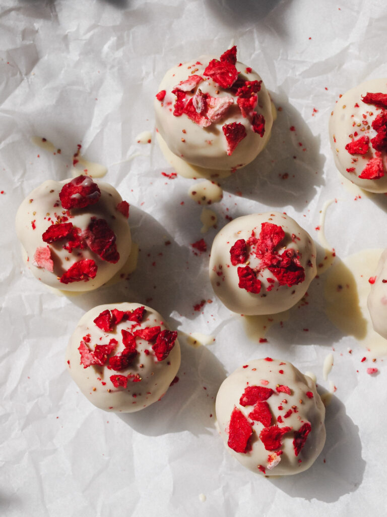 Strawberries and Cream Healthy Raw Vegan Bliss Balls with Strawberry Filling