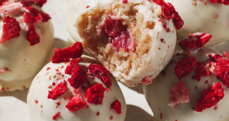 Strawberries and Cream Healthy Raw Vegan Bliss Balls with Strawberry Filling