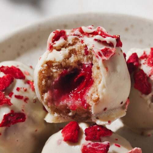 Strawberries and Cream Healthy Raw Vegan Bliss Balls with Strawberry Filling