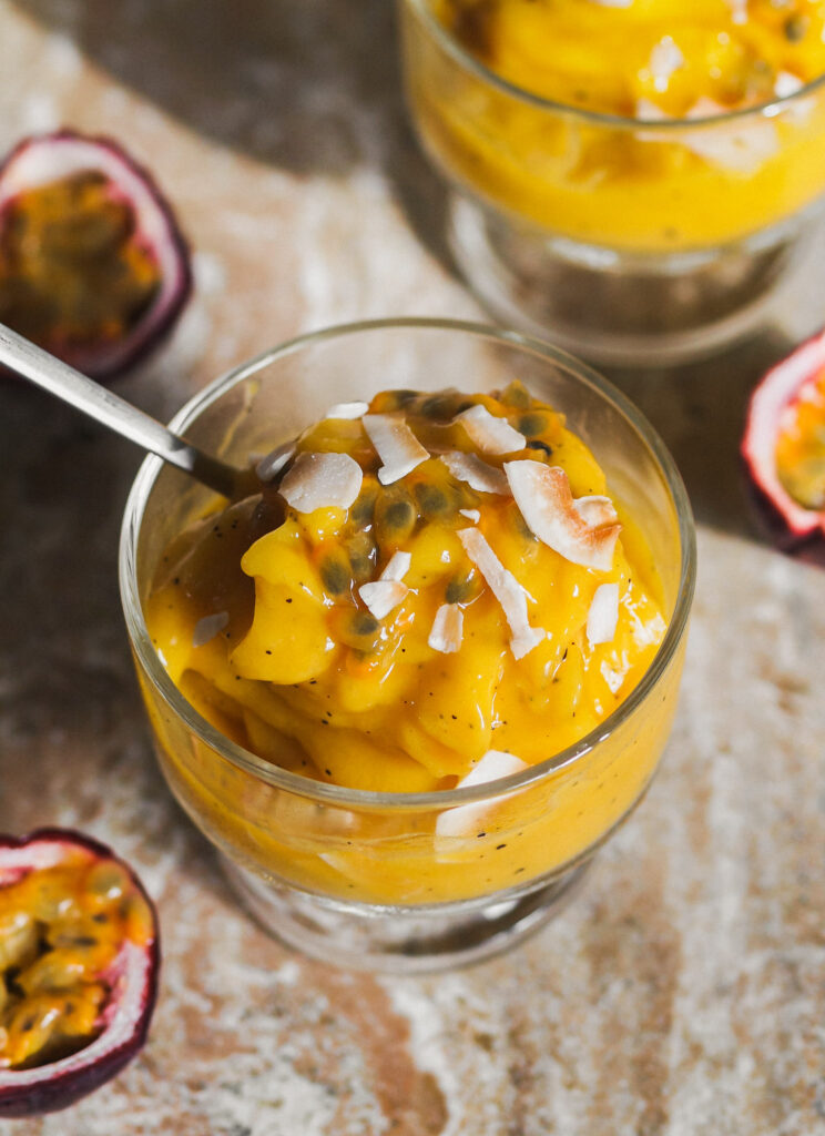 Tropical Sunshine Sorbet topped with toasted coconut flakes and fresh passion fruit 