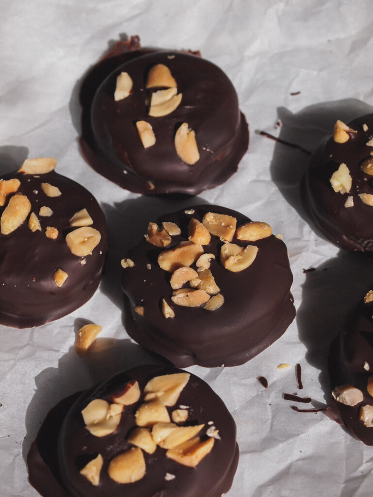 chocolate peanut butter Oreos dipped in chocolate and covered in roasted peanuts