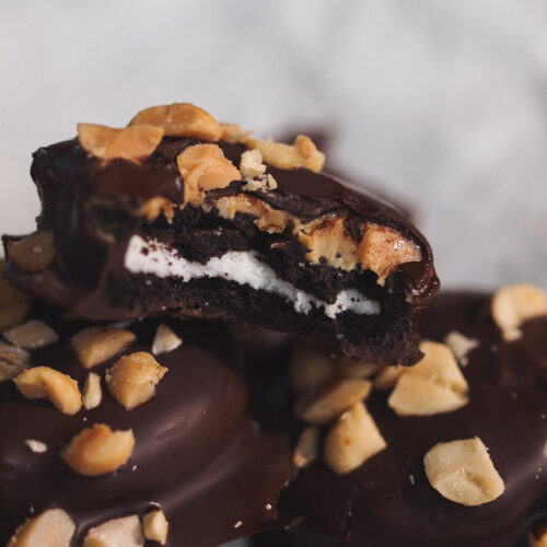 Peanut Butter Chocolate Dipped Oreos with a bite taken out